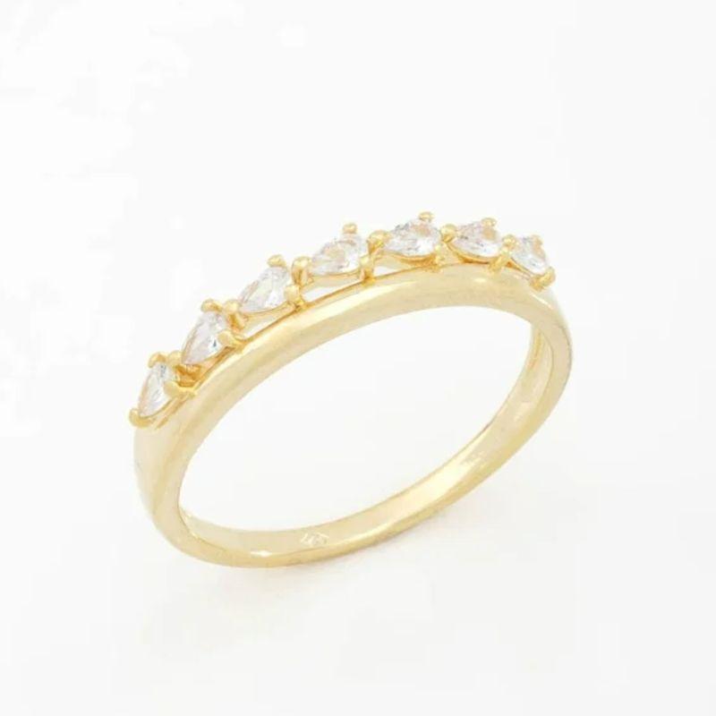 ANEL COM DETALHES EM ZIRCÔNIAS LAPIDADAS EM FORMATO DE GOTAS